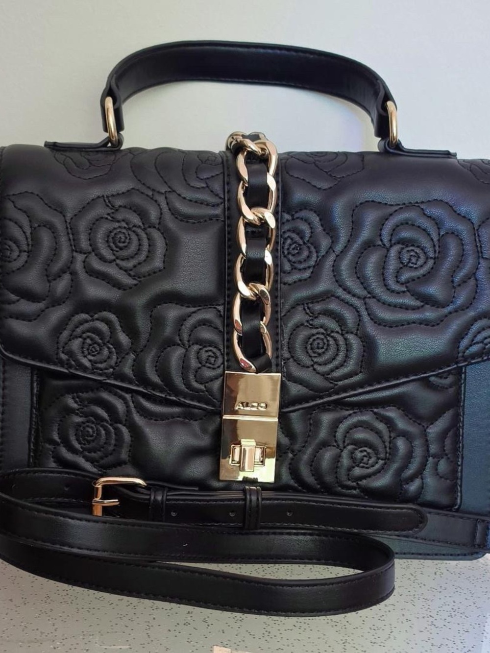 Aldo Black Quilted Rose-Embossed Satchel with Gold Chain Accent